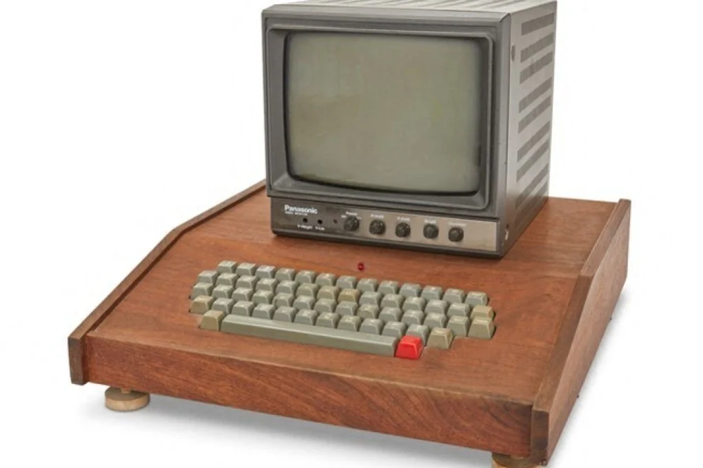Apple 1 in a wooden case with a Panasonic monitor and ASCII keyboard.