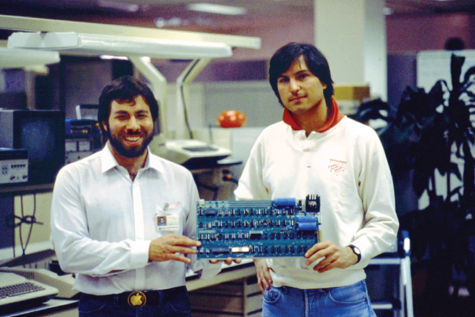 Steve Wozniak and Steve Jobs seated next to an Apple 1.